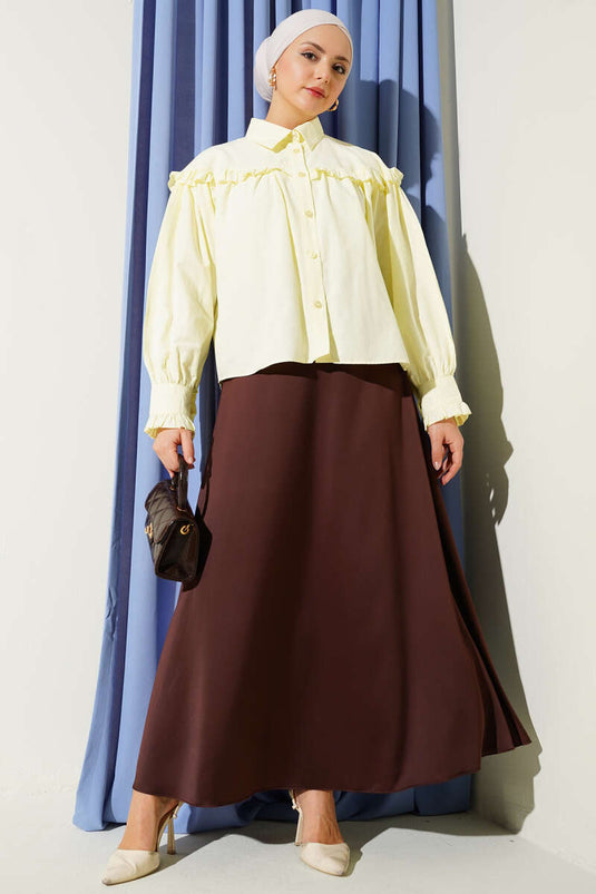 قميص قصير بتفاصيل كشكش باللون الأصفر