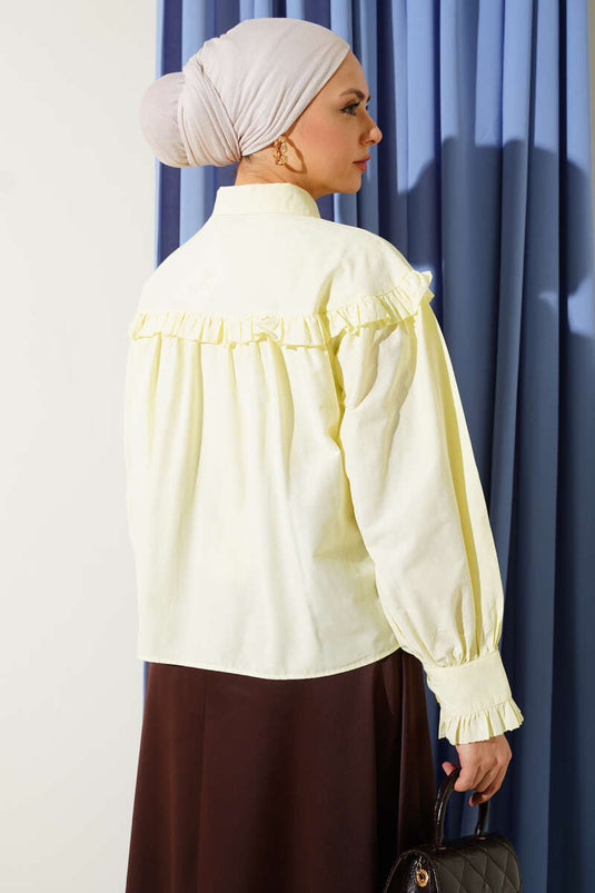 قميص قصير بتفاصيل كشكش باللون الأصفر