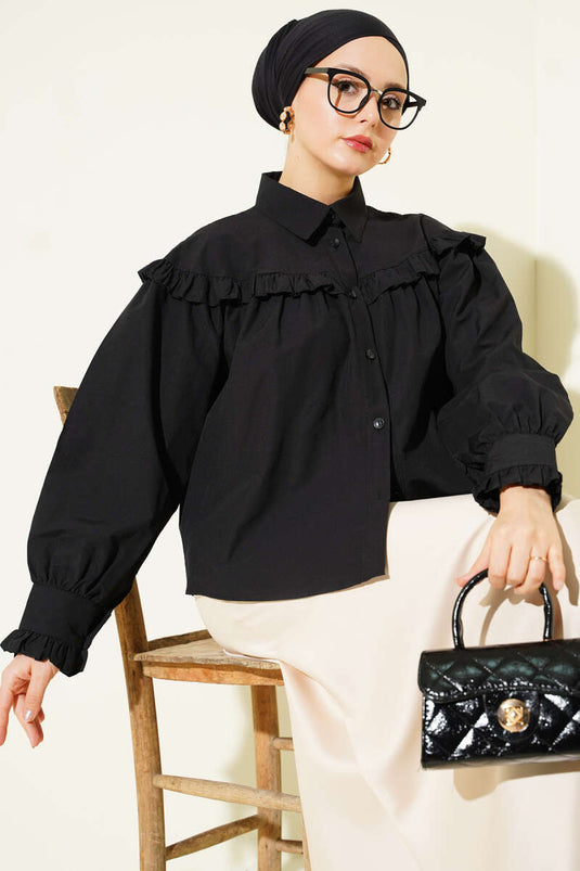 Chemisette noire à volants détaillés