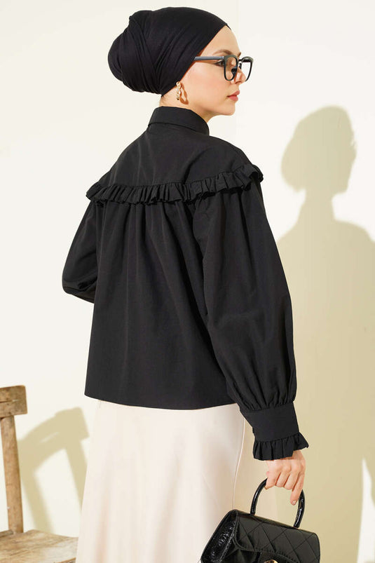 Chemisette noire à volants détaillés