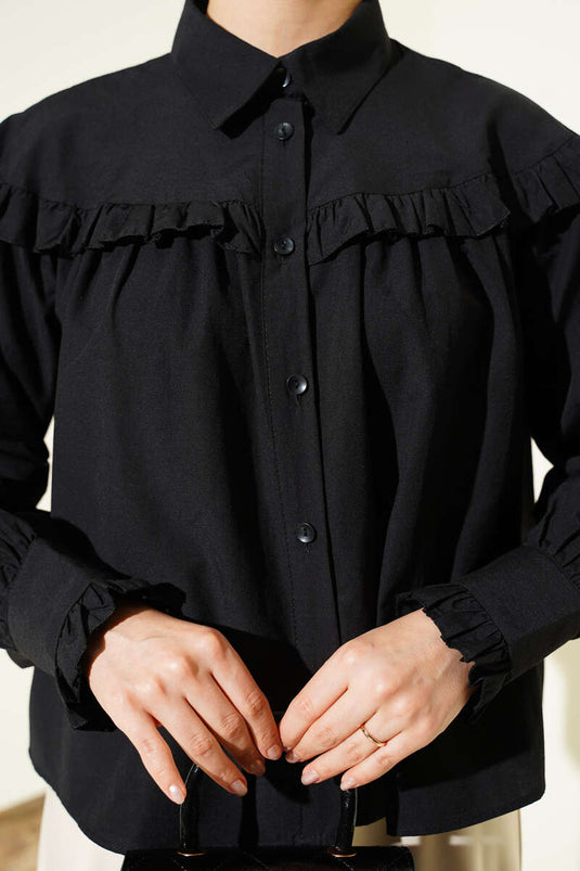 Chemisette noire à volants détaillés