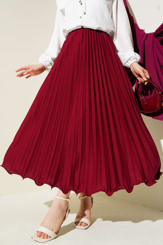 تنورة بخصر مطاطي مطوي ومكشكش باللون العنابي