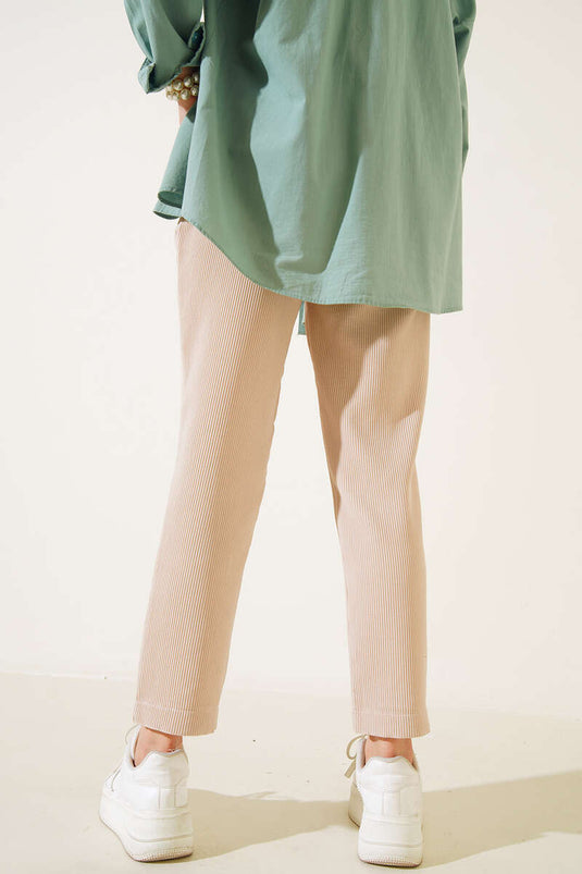 بنطال سكيني مضلع باللون البيج