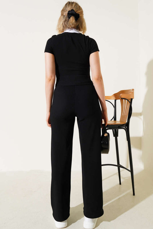 بدلة سوداء من قطعتين مزينة بقميص مخملي