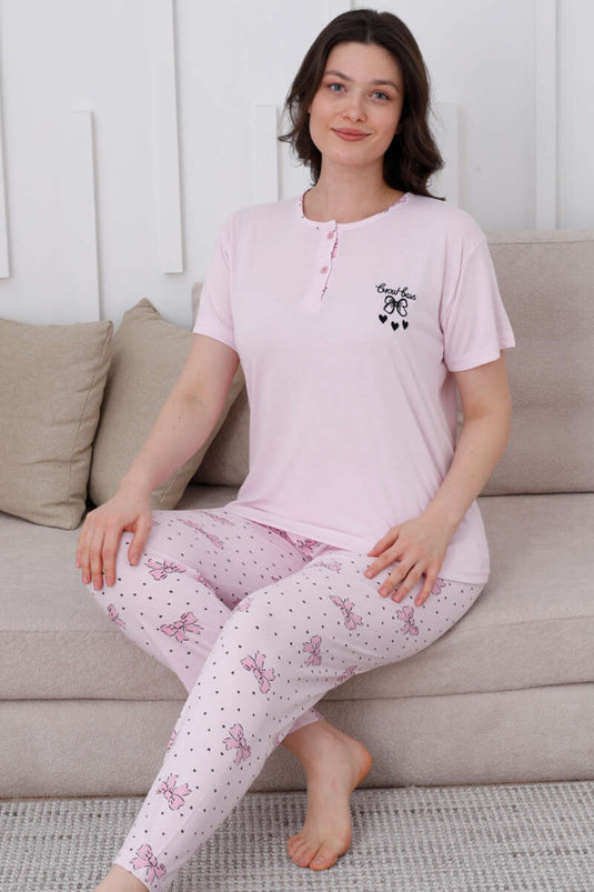 Ensemble pyjama rose à boutons et motif nœud