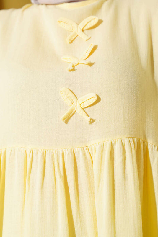 Yellow Muslin Dress with Bow Detail