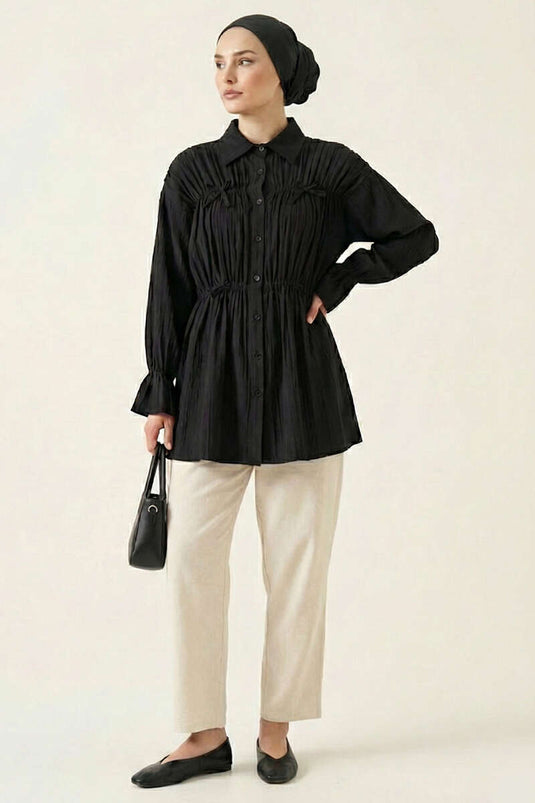 Chemisier noir à manches élastiquées avec nœud