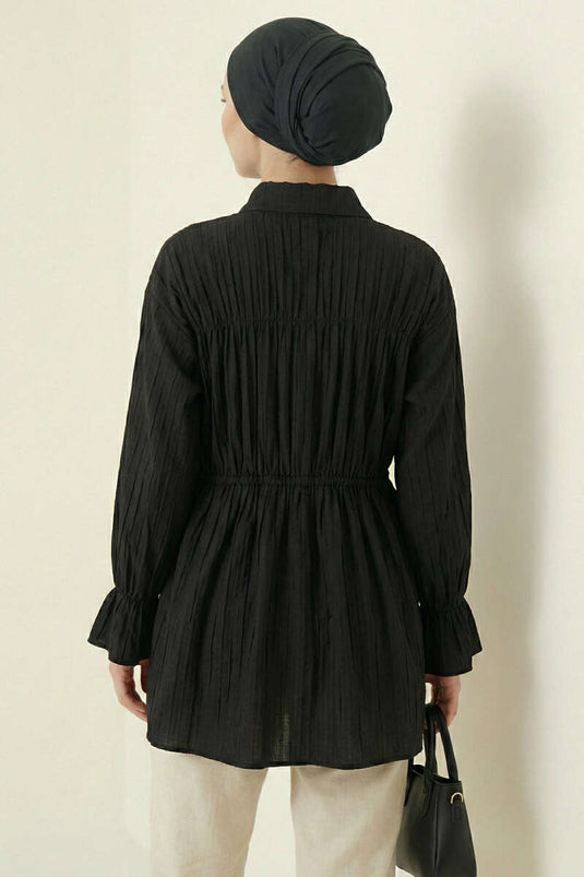 Chemisier noir à manches élastiquées avec nœud