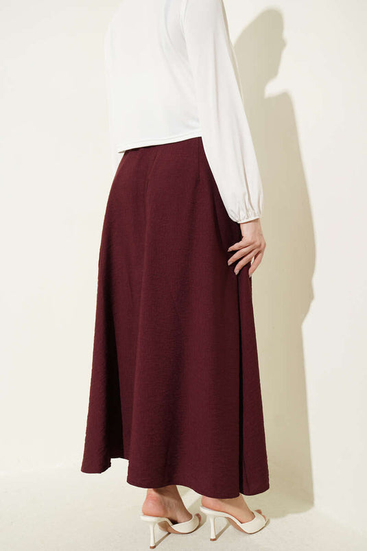 Jupe plissée avec large ceinture bordeaux