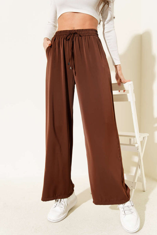بنطال تنسيل بخصر مطاطي وقصة أرجل واسعة - بني