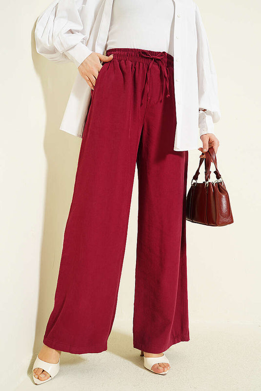 Pantalon Tensel bordeaux à taille élastique et jambes larges