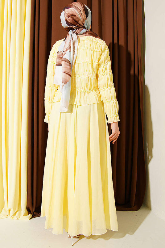 Ensemble deux pièces Gipeli avec blouse et jupe jaune