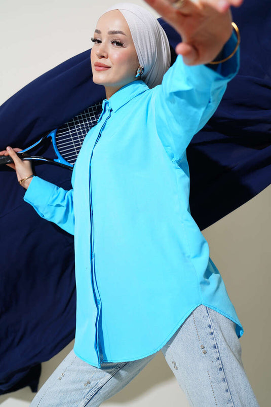 قميص أساسي بأزرار مخفية باللون الأزرق