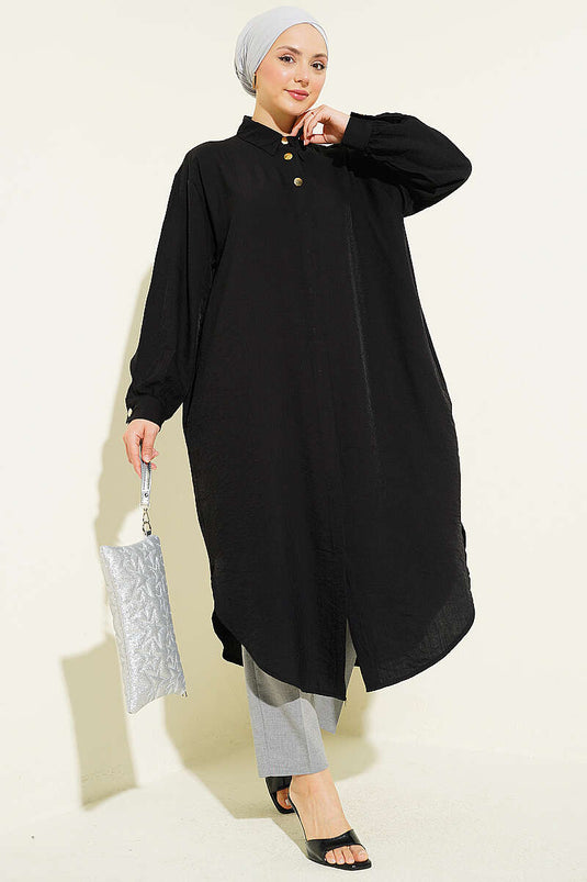 Chemise longue noire avec poches et boutons cachés