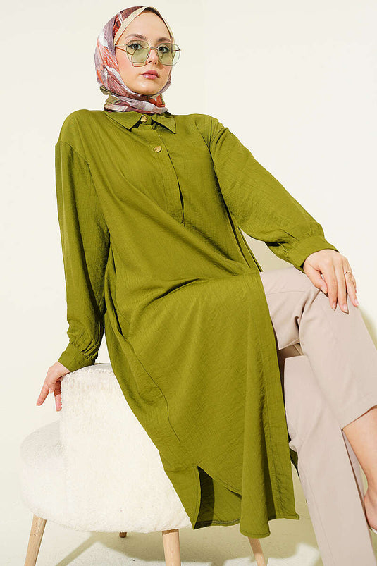 Chemise longue verte avec poches et boutons cachés