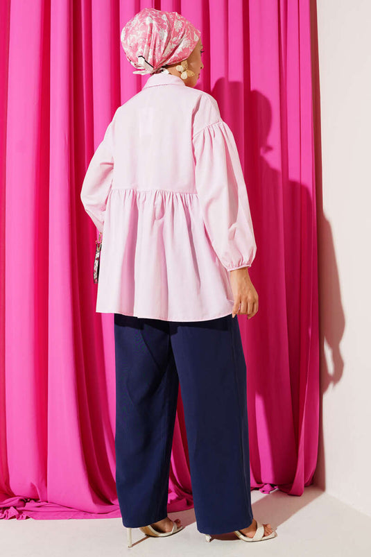 Chemise rose à boutons cachés et boutons boule