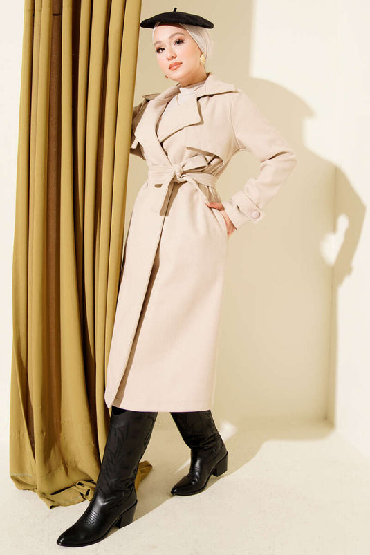 Manteau en cachemire beige avec détail buste