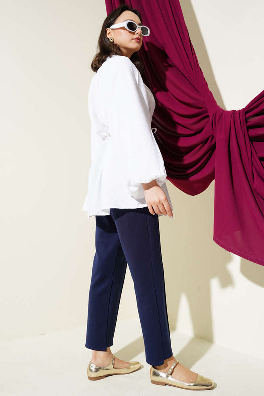 Chemise blanche à manches ballon et boutons dorés