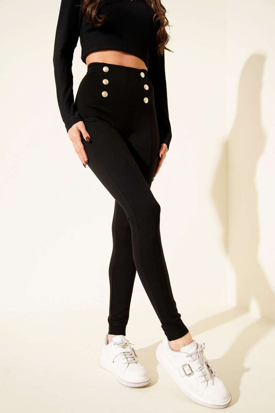 Pantaloni a gamba stretta con bottoni dorati neri