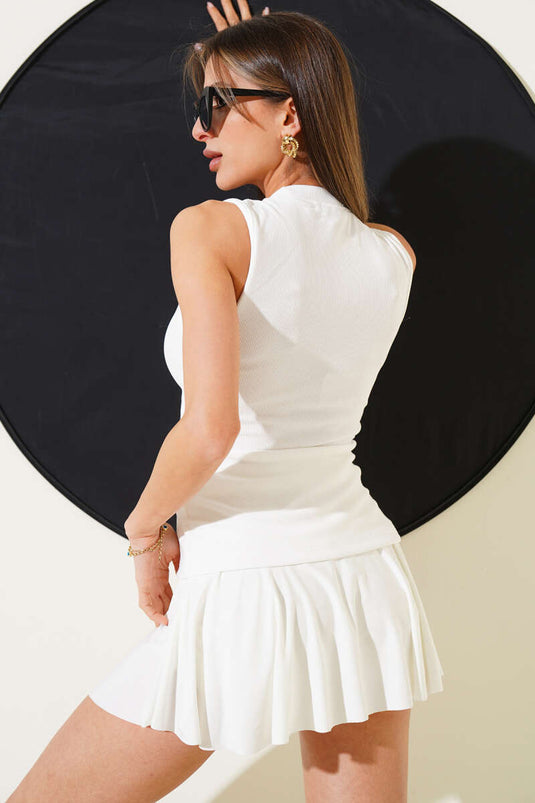 Chemisier côtelé blanc à boutons dorés