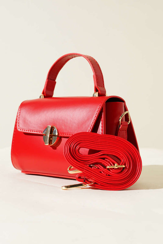 Sac rouge à fermeture éclair dorée