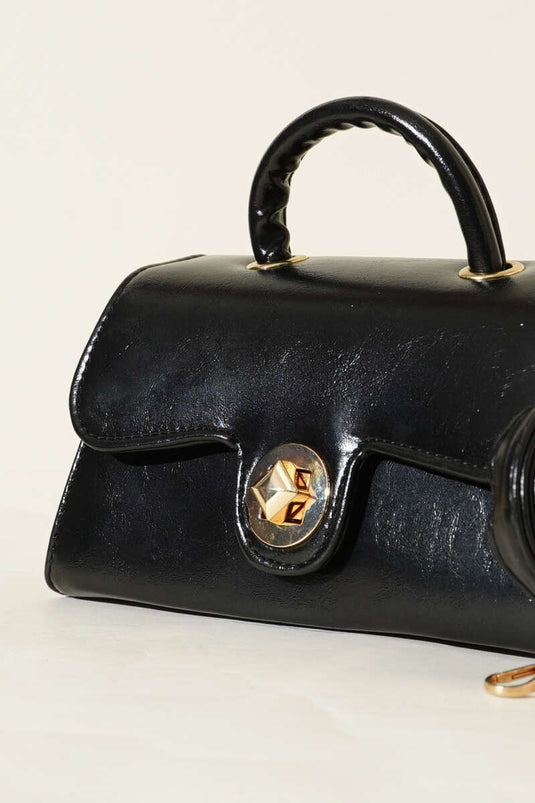 Sac en cuir verni noir avec fermoir doré