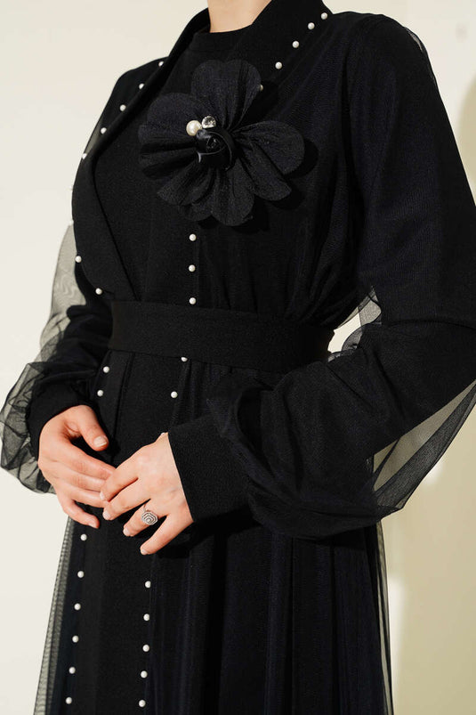 Abaya negra con detalle de rosa