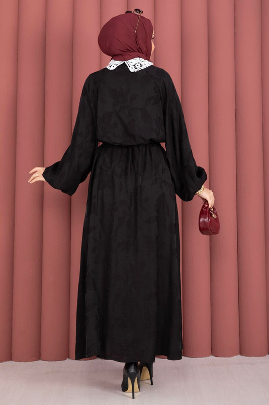 Zwarte blouse-rok set met guipure kraag en knopen aan de voorkant