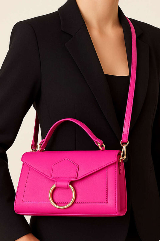 Tas van lakleer met ringdetails in fuchsia