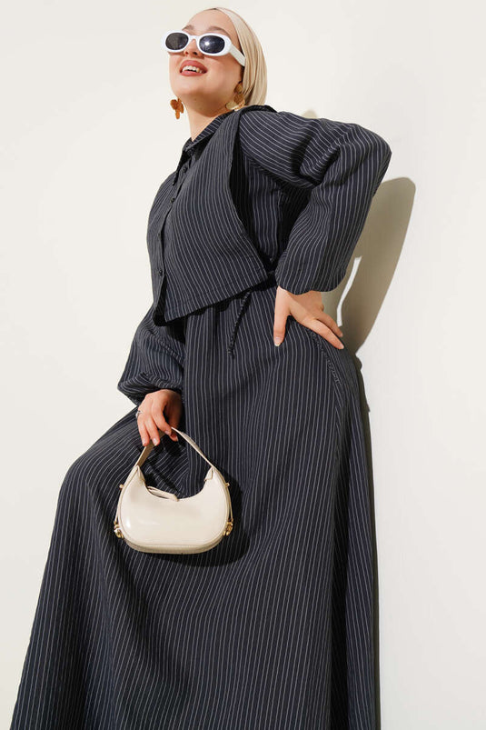 فستان مخطط من قماش التنسل باللون الأسود