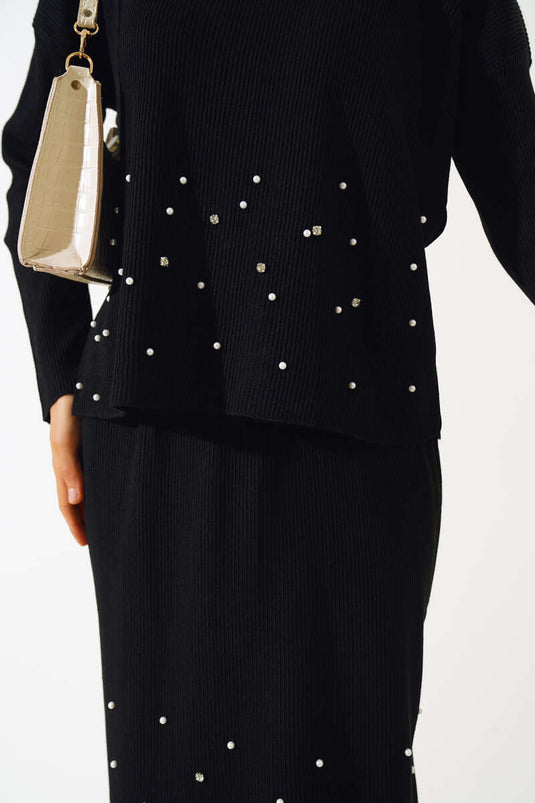 Conjunto de dos piezas de punto con falda adornada con perlas en negro