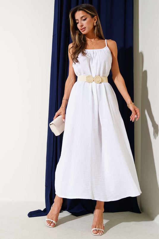 فستان موسلين فضفاض بأشرطة رفيعة، لون بيج فاتح.