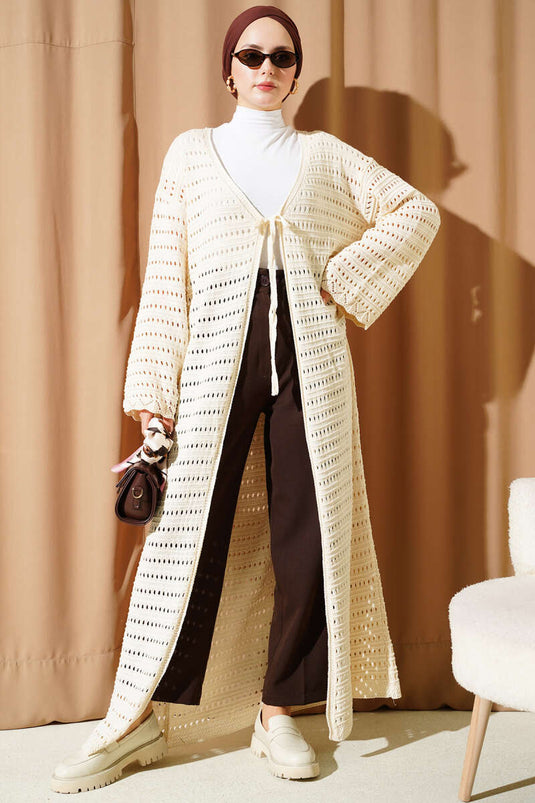 Cárdigan largo de punto calado con cordón beige