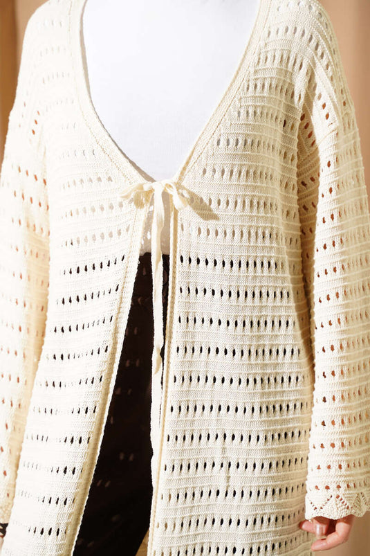 Cárdigan largo de punto calado con cordón beige