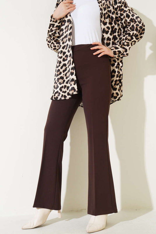 Spanish-style flared double-waisted trousers in dark brown with elastic waistband.