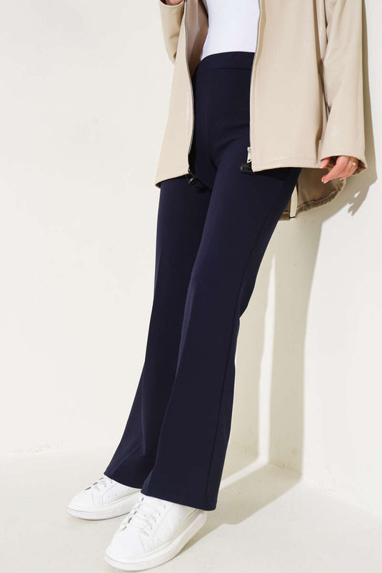 Spanish-style flared double-waisted trousers, navy blue.