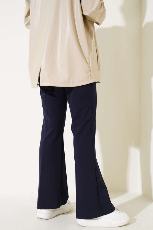 Spanish-style flared double-waisted trousers, navy blue.