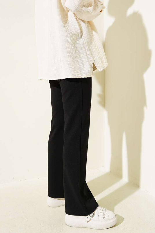 Pantalon noir à taille élastique et jambes espagnoles