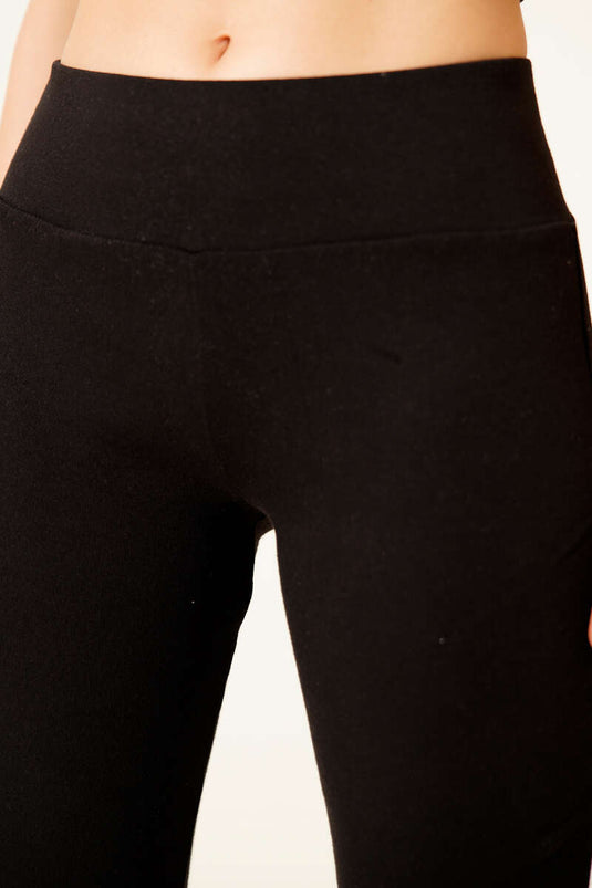 Black Spanish-style flared trousers