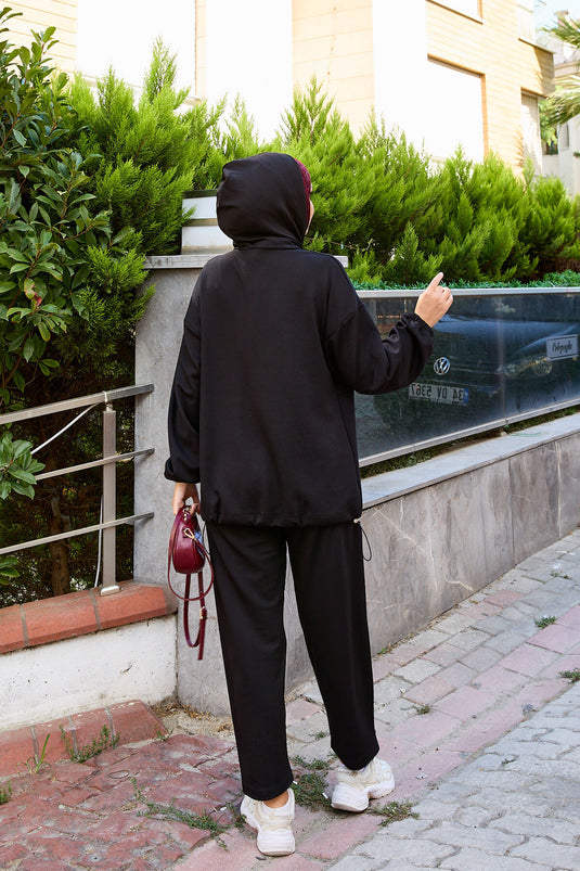 بدلة أويشو سوداء من قطعتين بغطاء رأس وسحاب