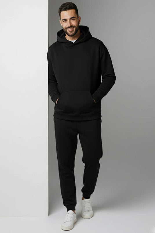 طقم بدلة رياضية بسحاب مع قبعة وأساور عند الكاحل باللون الأسود