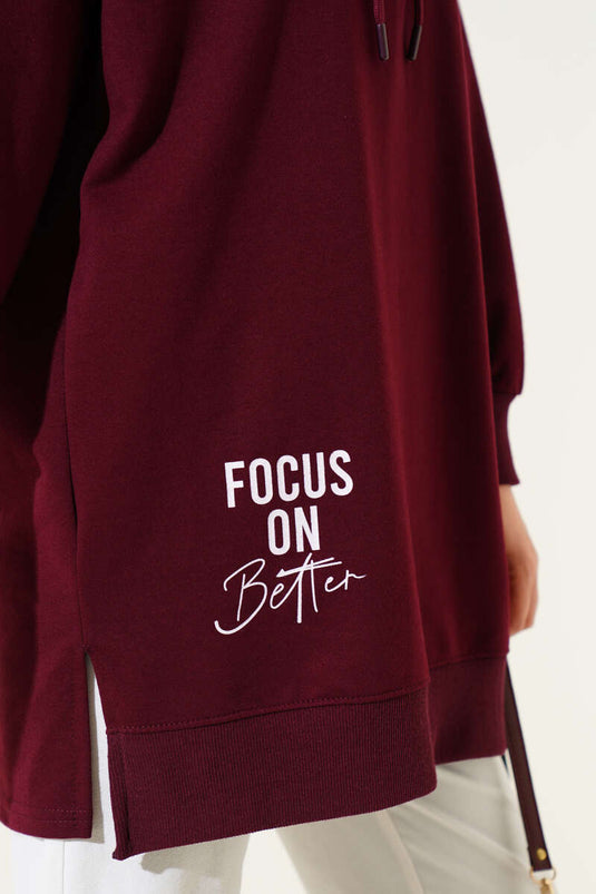 Tunique imprimée bordeaux à demi-fermeture éclair avec capuche