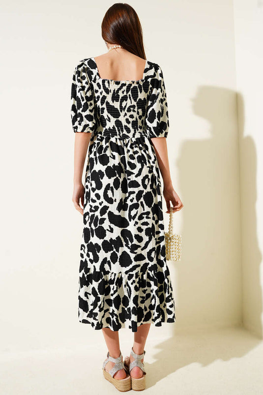 Robe midi noire à col carré en gipel