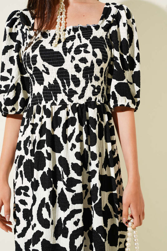 Robe midi noire à col carré en gipel