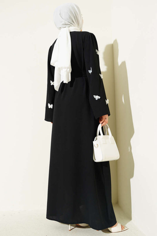 Ferace noire ceinturée avec perles et papillons