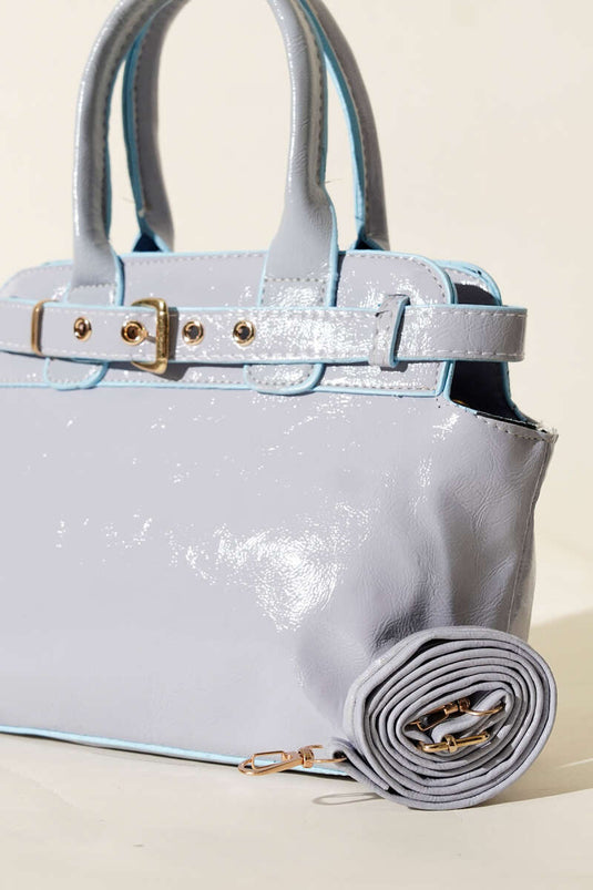 Dettaglio clip per cintura Borsa lucida blu bambino