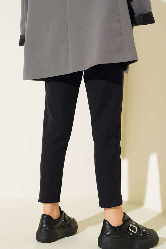 Pantalon en tissu noir avec ceinture et fermeture auto-agrippante