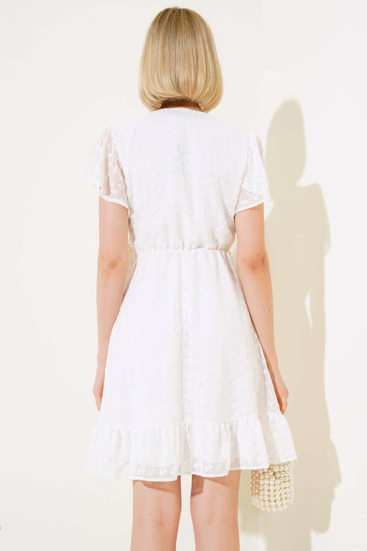 Robe écrue à motif floral ton sur ton