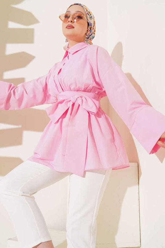 Tunique rose avec ceinture assortie et devant froncé