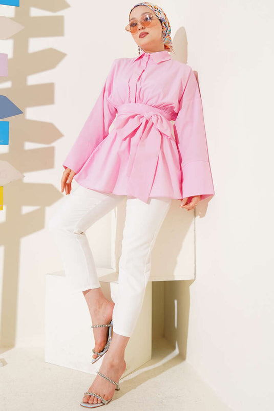 Tunique rose avec ceinture assortie et devant froncé